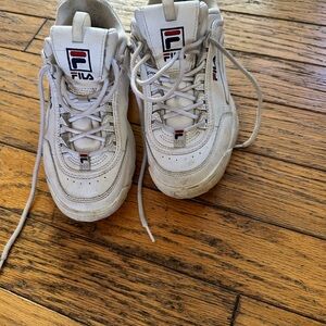 Fila White sneakers. Lots of wear left in these kicks.